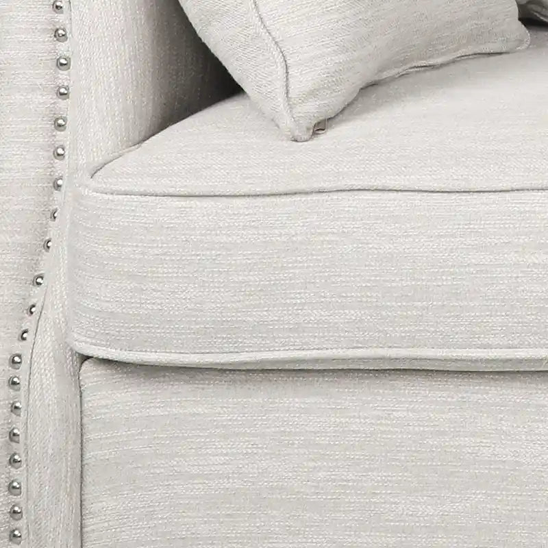 Canapé 3 places en tissu à dossier coussin avec garniture cloutée